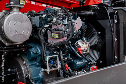 Construction machinery engine close up with pipes and valves