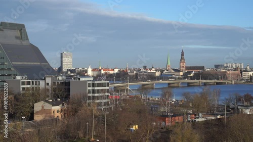 Wallpaper Mural Riga landmarks over the river Daugava with all buildings in the background. Bridge over river. Latvian city centre. Baltic states capital Torontodigital.ca