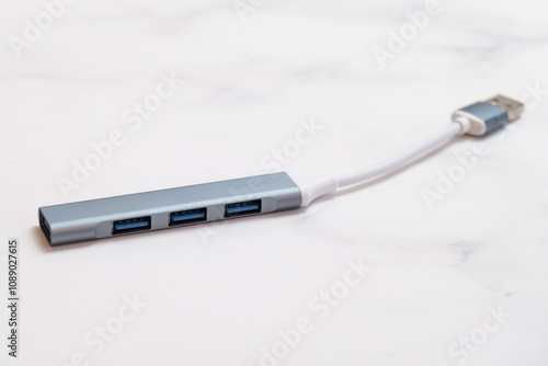 Port Multi Splitter Adapter USB hub for connecting additional equipment to a computer or laptop. Additional USB ports in a metal case on a short wire.