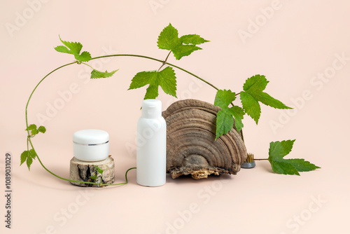 cosmetics containers on a wooden podium surrounded by a hop bush with leaves and a tinder box. The concept of a natural cosmetic skin care product