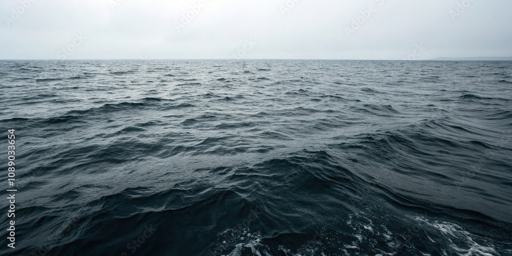 Fototapeta premium Dark waters with subtle ripples and waves, fluid motion, dark water, gentle lapping, luminous hues