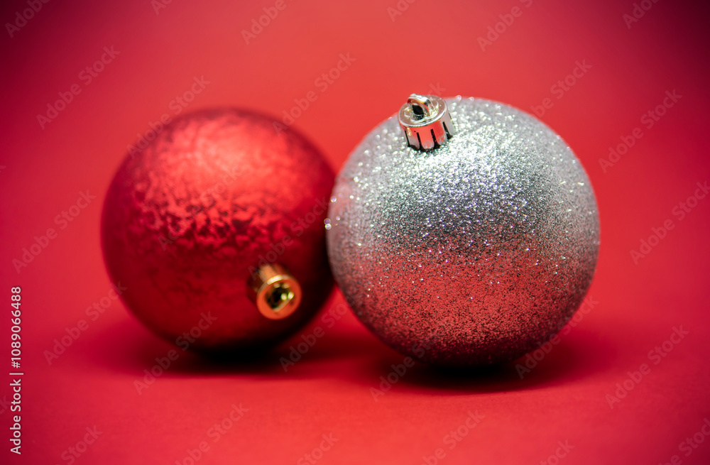 Red and silver Christmas ornaments on a red background Red and silver Christmas ornaments on a red background