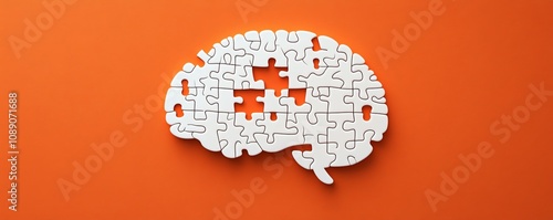 Concept of memory loss and mental health, brainshaped white jigsaw puzzle with missing piece on an orange background, emotional visual photo