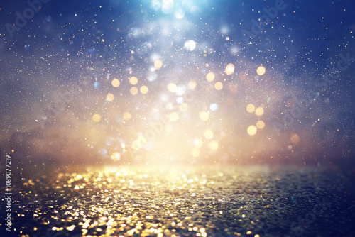 background of abstract glitter lights. blue, gold and black. de focused