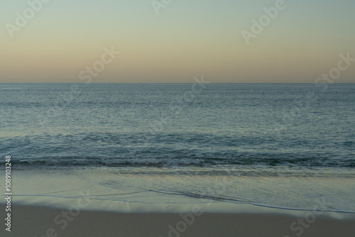 View of the beach and sea at dawn, in Biarritz (France). The Atlantic Ocean.