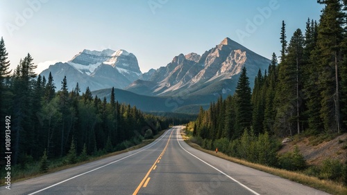 Empty stretch of asphalt road running parallel to a mountain range with a clear blue sky above and pine trees in the foreground, peaceful scene, empty highway, asphalt road