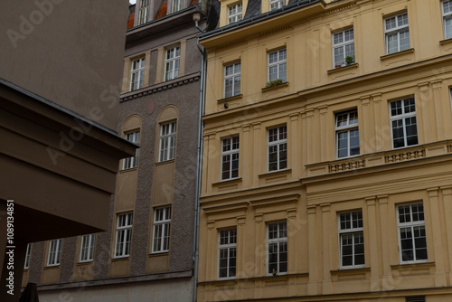 The facade view of vintage buildings beautifully showcases various architectural styles set within an urban environment that is rich with culture and history, drawing the eye of every observer photo