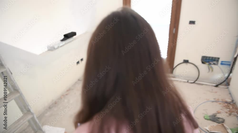 Augmented Reality: Girl Using Tablet to Place Virtual Objects in an Empty Room Augmented Reality: Girl Using Tablet to Place Virtual Objects in an Empty Room