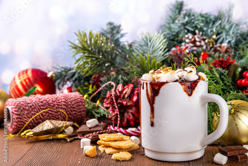 Mug with S`mores hot chocolate or coffee, thick smores hot cocoa or latte drink with toasted marshmallow, graham cracker and chocolate topping photo