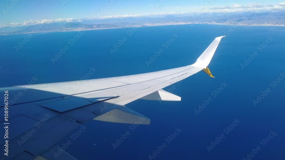 from airplane wing mediterranean sea aircraft banks approach to malaga airport perspective enhances travel dynamic view scenic experience flight delight from airplane wing mediterranean sea aircraft banks approach to malaga airport perspective enhances travel dynamic view scenic experience flight delight