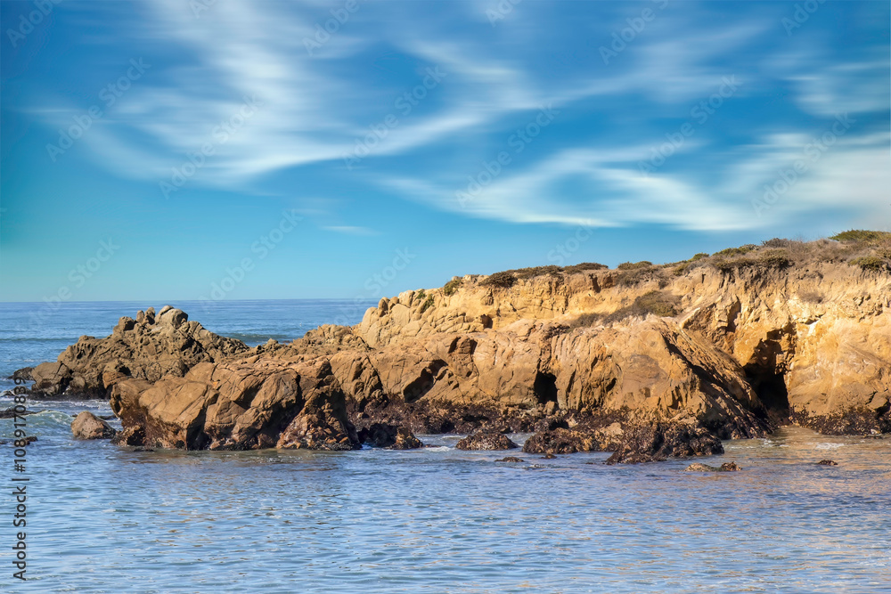 View of bluffs overlooking the Pacific Ocean in daytime, blue sky, soft clouds, nobody View of bluffs overlooking the Pacific Ocean in daytime, blue sky, soft clouds, nobody