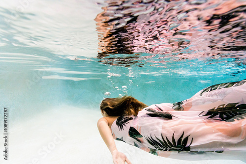 Underwater portrait of a young woman  photo