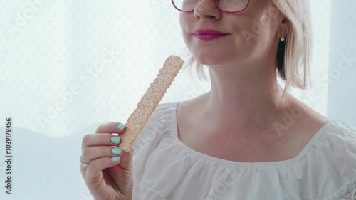 Close up of woman mouth eating crispy bread and smiling, healthy lifestyle with products that doesn't harm your health