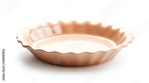 Pink ceramic pie dish with scalloped edges, isolated on a white background.