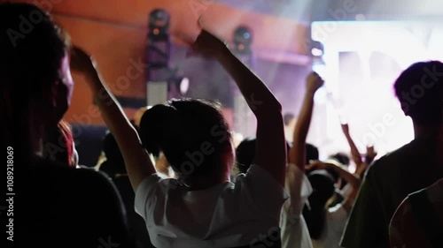 People hands making rock gesture at the concert, slow motion video