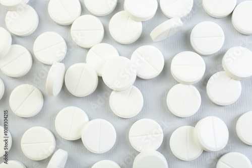 Many antibiotic pills on grey background, closeup