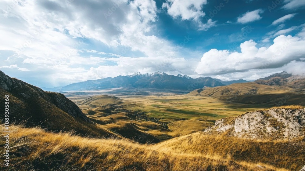 Breathtaking panorama of expansive wilderness featuring rolling hills, dramatic mountains, lush valleys, and a dynamic sky filled with clouds. Breathtaking panorama of expansive wilderness featuring rolling hills, dramatic mountains, lush valleys, and a dynamic sky filled with clouds.