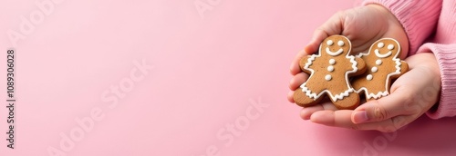Wallpaper Mural Banner with close photo of children holding gingerbread men on a pink background Torontodigital.ca