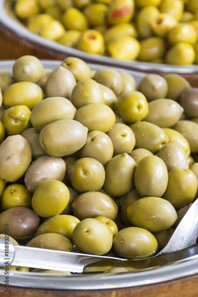Fresh green olives in barrels. Traditional Greek addition to dishes Fresh green olives in barrels. Traditional Greek addition to dishes