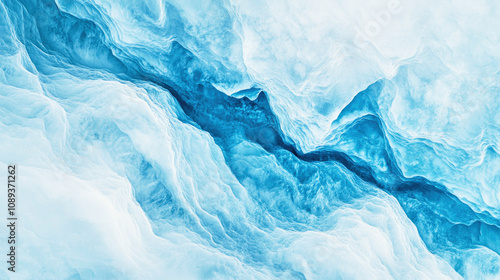 Soft patterns of untouched snow with blue and white gradients seen from above