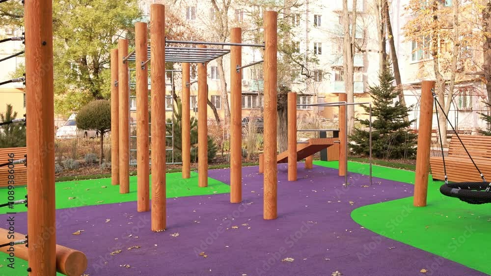 Modern children's playground near a residential building. Modern children's playground near a residential building.