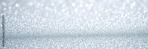 Glittering background featuring an array of tiny silver glitter dots that create a sense of depth and dimensionality, luminous sheen, glittery background