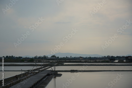 Wallpaper Mural Tranquil sunset over water coastal town landscape photography serene environment wide angle view nature's beauty Torontodigital.ca