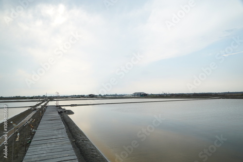 Wallpaper Mural Tranquil sunrise reflections over salt flats coastal region photography serene landscape wide angle nature's beauty Torontodigital.ca