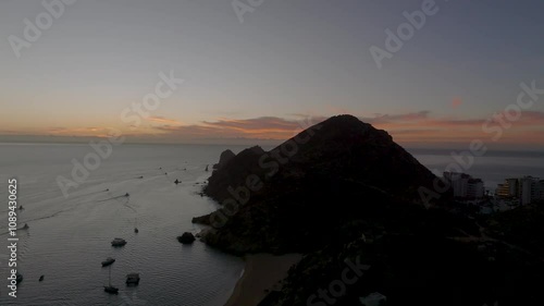 Sunrise in Cabo San Lucas Mount Solmar Baja California Sur Mexico Sunny Beaches Whales Yachts and Boats	 photo