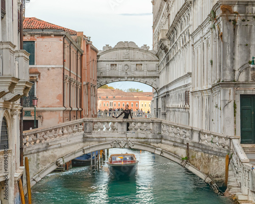 Woman with view bridge of Sighs (Ponte dei Sospiri). Venice, Italy.