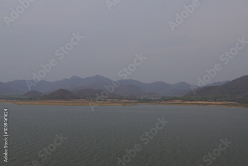 Serene lake landscape at dusk mountainous region nature photography calm waters aerial view tranquility and reflection