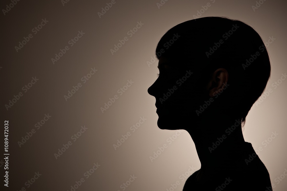 Low-Key Silhouette of a Woman’s Profile with Subtle Backlighting