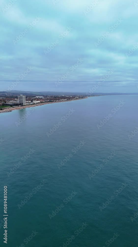 the sea and the sky - 4k Static Drone shot of Worthing, West Sussex Coastline the sea and the sky - 4k Static Drone shot of Worthing, West Sussex Coastline