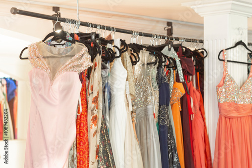 Colorful Evening Wedding Formal Prom Dresses on Retail Store Rack photo