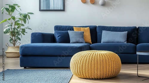 Sophisticated Living Room Design with Blue Sofa and Mustard Accent
