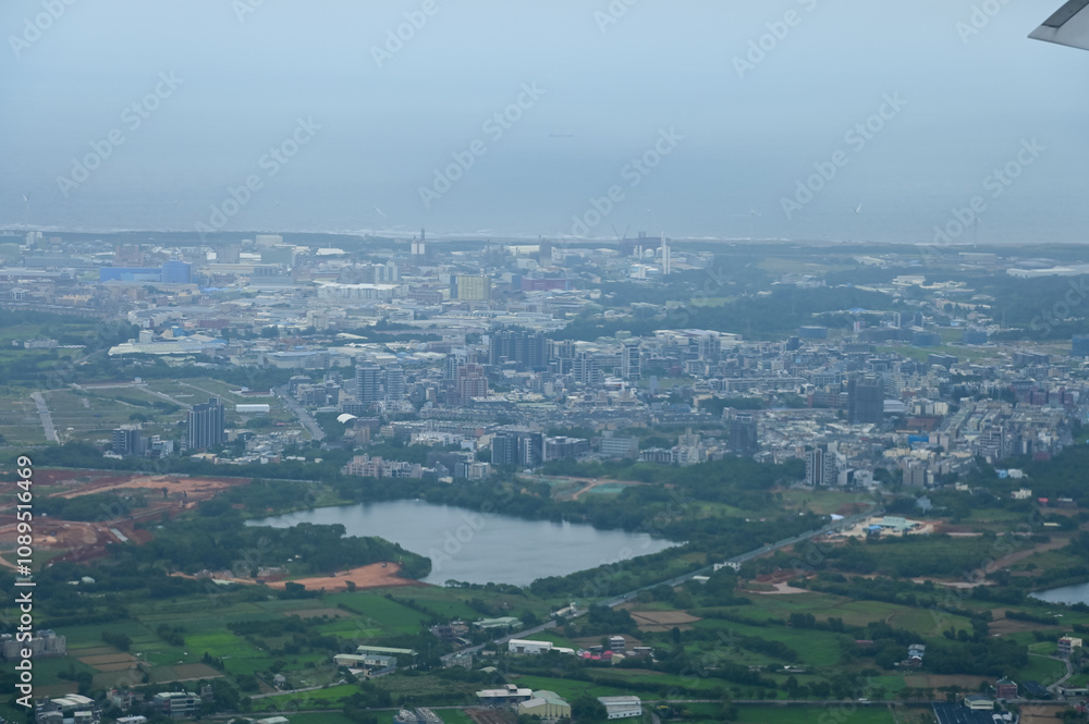 Looking from airplane of the Taipei city view, Taiwan. Ariel view of Taipei cityscape. Stunning nature and cityscape. Travel concept. Looking from airplane of the Taipei city view, Taiwan. Ariel view of Taipei cityscape. Stunning nature and cityscape. Travel concept.