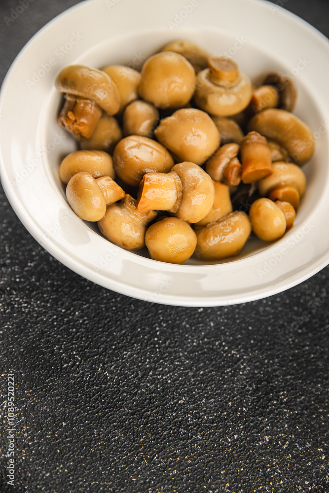 Champignon mushroom canned product tasty food dish fresh delicious gourmet food background on the table rustic food top view copy space top view keto and paleo diet Vegetarian and vegan food Champignon mushroom canned product tasty food dish fresh delicious gourmet food background on the table rustic food top view copy space top view keto and paleo diet Vegetarian and vegan food