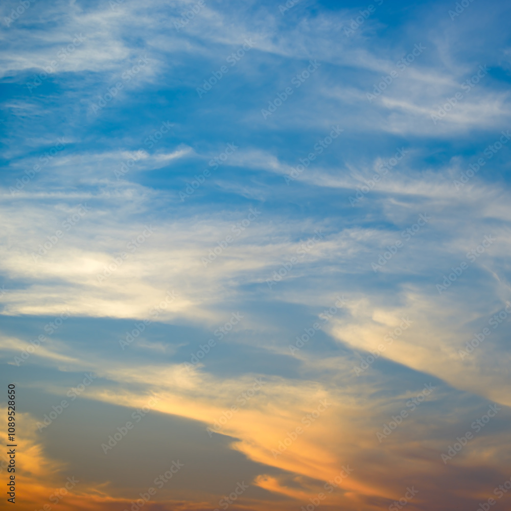 Fototapeta premium Bright orange sun against blue sky.