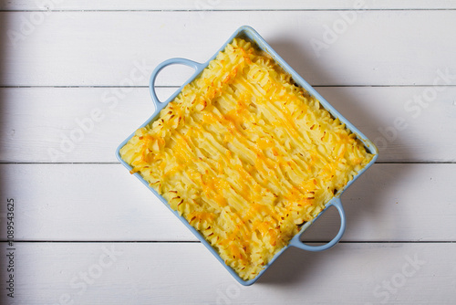 Creamy fish pie or fisherman's pie - traditional British and Irish dish. View from above, top studio shot