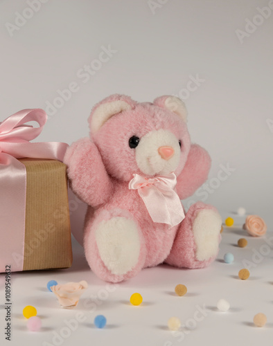 Greeting card for the holiday. A teddy bear and a birthday present.