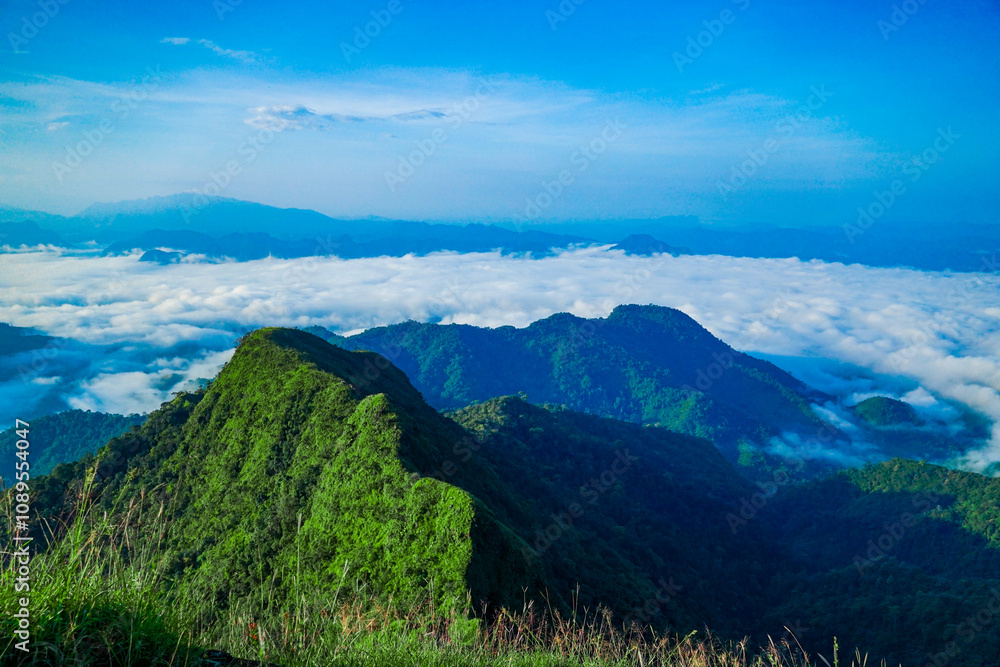 Naklejka premium Breathtaking mountain landscape cloudy valley nature photography scenic view tranquil atmosphere adventure inspiration