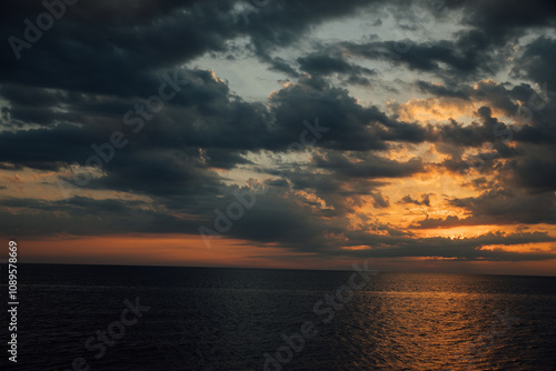 Beautiful scenery sea on the horizon with clouds at sunset