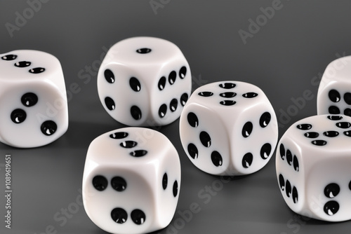 Five white dice with black spots on them. A game with a gray background and dice. Dice game gray background white cube. A cube with white and gray dice on a lifestyle background. photo