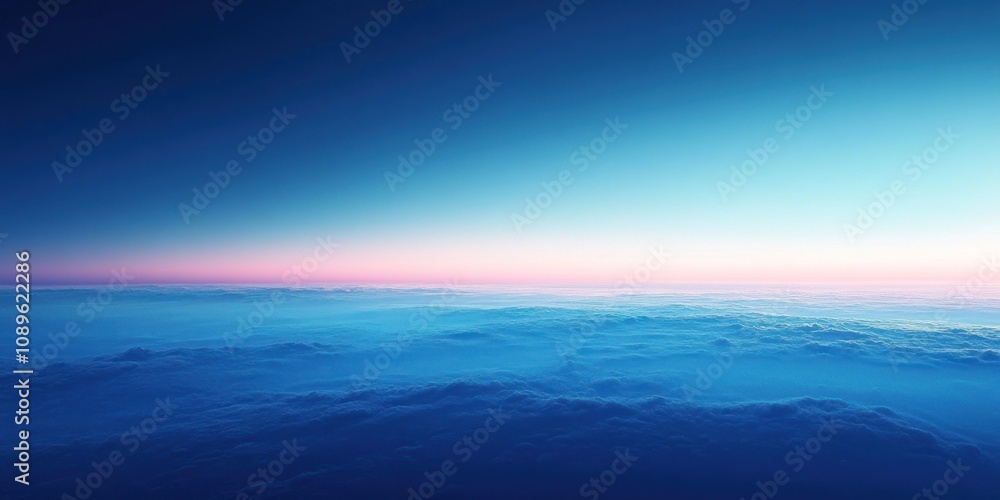 Obraz premium Aerial View Of Pink And Blue Sunset Over Clouds