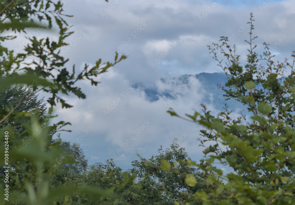 the mountain appears between clouds the mountain appears between clouds