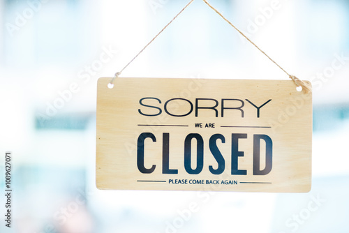 Closed sign on a cafe door, signaling the end of a business day with a polite message. photo