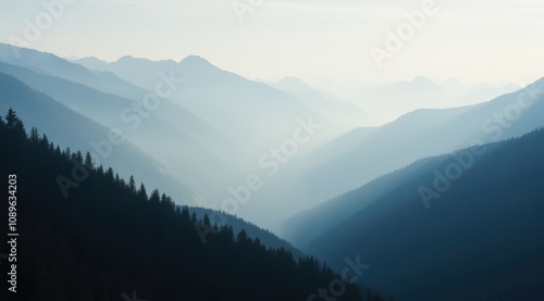 Misty mountain valleys in soft blue tones