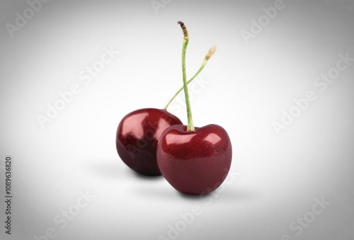 single fresh ripe red cherry with stem photo