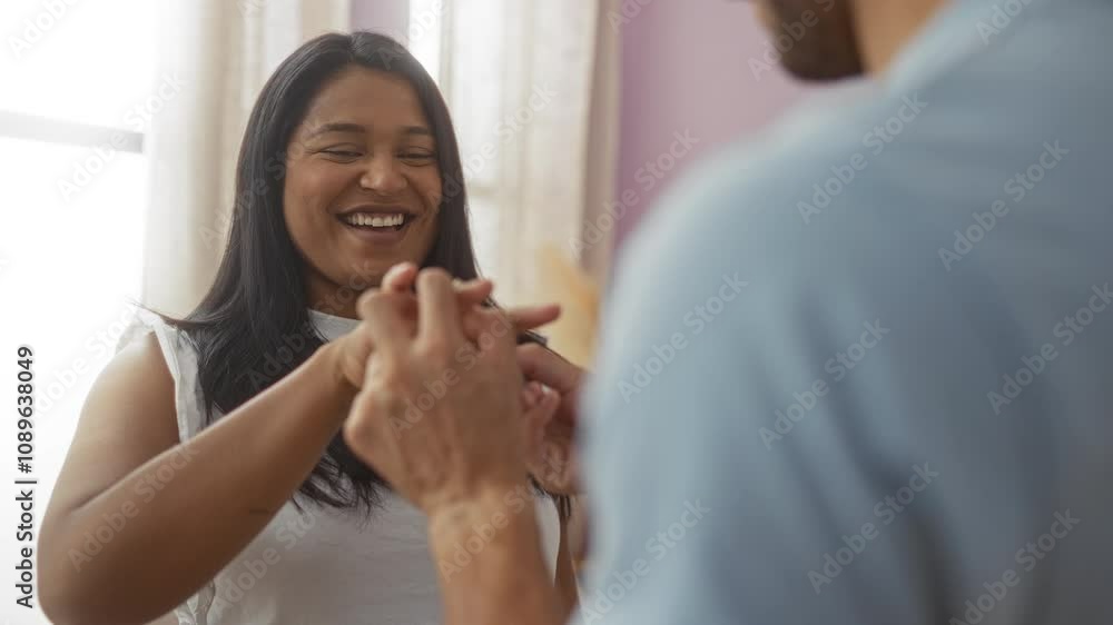 Woman happily receiving ring from man in cozy living room moments before sharing tender kiss, capturing a loving couple in an intimate indoor setting Woman happily receiving ring from man in cozy living room moments before sharing tender kiss, capturing a loving couple in an intimate indoor setting