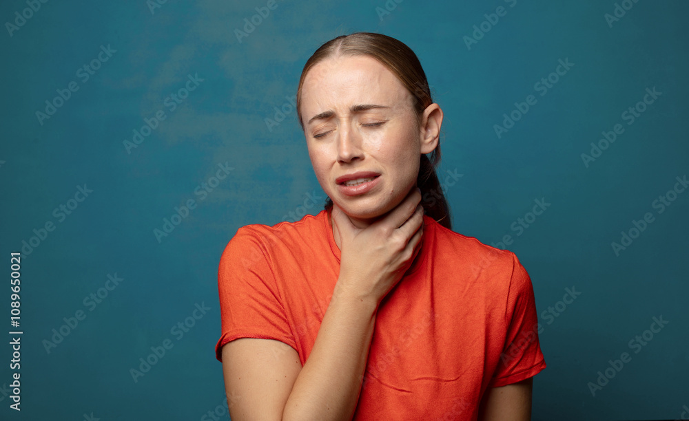 feeling ill with a sore throat and flu symptoms, coughing with mouth covered feeling ill with a sore throat and flu symptoms, coughing with mouth covered